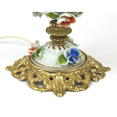 2217 - Floral encrusted porcelain and gilt lamp with glass shade, 53cm high