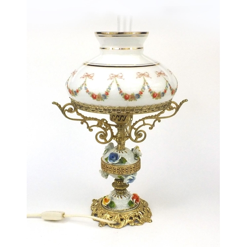 2217 - Floral encrusted porcelain and gilt lamp with glass shade, 53cm high