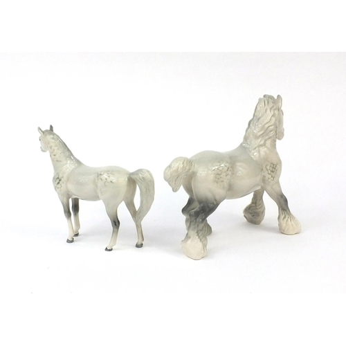 2109 - Two Beswick dappled grey horses including a Shire horse, each with factory marks to the bases, the l... 