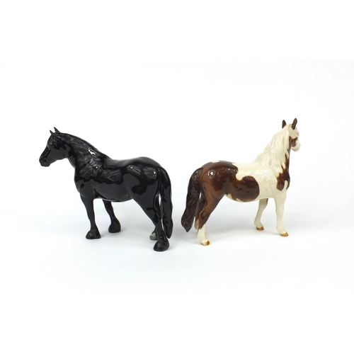 2114 - Two Beswick ponies comprising a Dale and a Pinto, each with factory marks to the bases, the larger 1... 