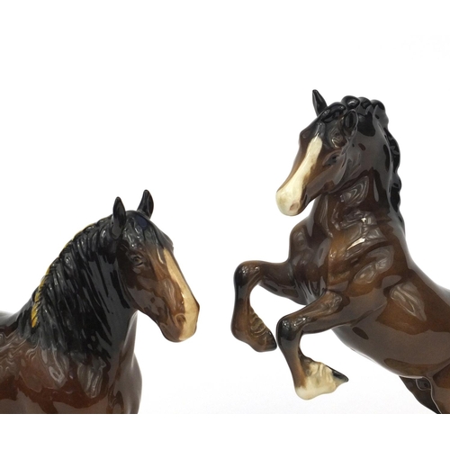 2113 - Two brown Beswick horses comprising a rearing example numbered 1014 and a Shire horse, each with fac... 