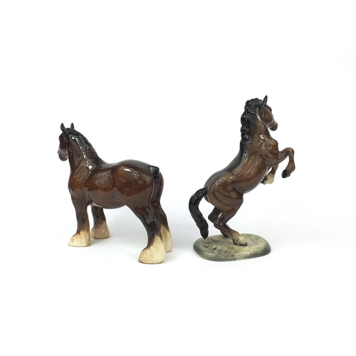 2113 - Two brown Beswick horses comprising a rearing example numbered 1014 and a Shire horse, each with fac... 