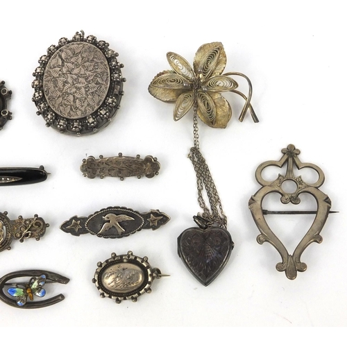 2603 - Selection of mostly silver jewellery including Victorian brooches, a large oval locket, enamelled br... 