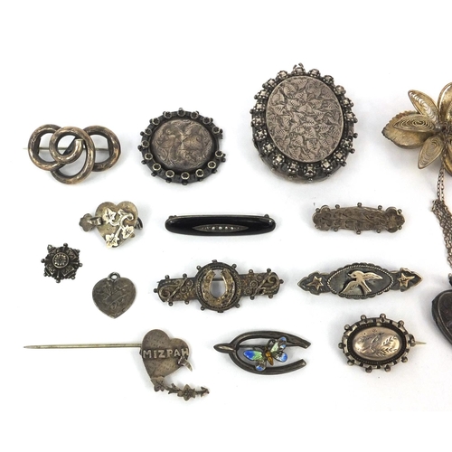 2603 - Selection of mostly silver jewellery including Victorian brooches, a large oval locket, enamelled br... 