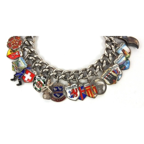 2615 - Silver charm bracelet with a large selection of enamelled shield souvenir charms, approximate weight... 