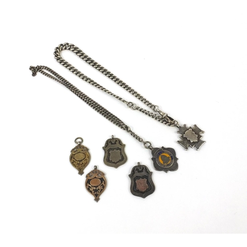 2635 - Six silver sports jewels and two silver watch chains, approximate weight 136.0g