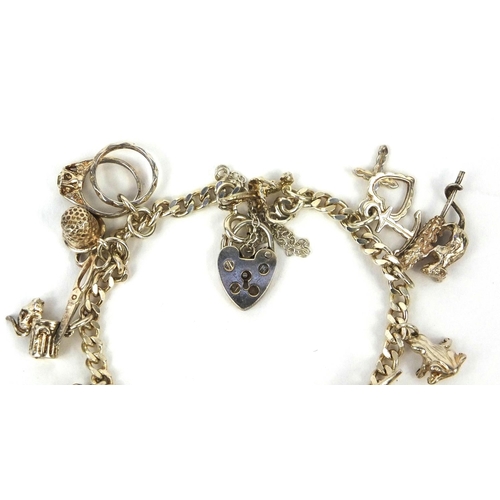 2688 - Silver charm bracelet with a selection of white metal charms including animals, classic car etc appr... 