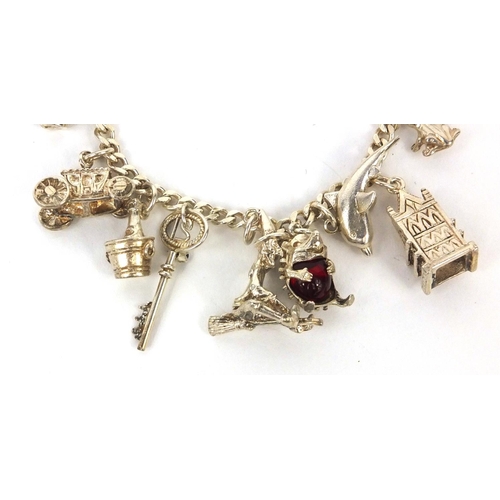 2688 - Silver charm bracelet with a selection of white metal charms including animals, classic car etc appr... 