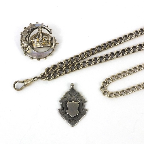 2535 - Silver jewellery comprising two watch chains, a crown brooch and a sports jewel, approximate weight ... 