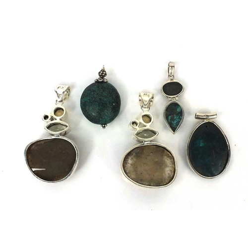 2533 - Five silver pendants set with semi precious stones including turquoise and quartz, the largest 7cm l... 