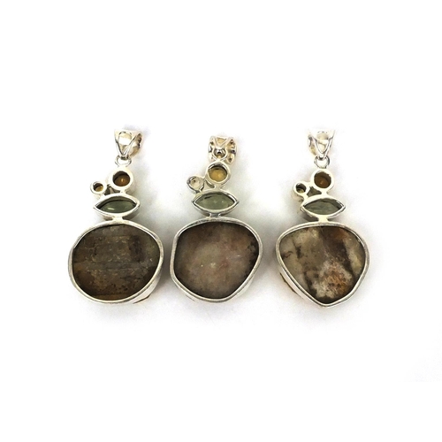 2639 - Three large silver pendants set with semi precious stones including citrine and quartz, the largest ... 