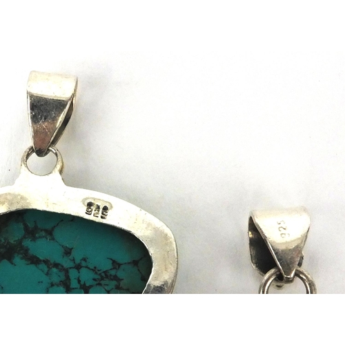 2543 - Four large silver pendants set with semi precious stones including turquoise, quartz and amethyst, t... 