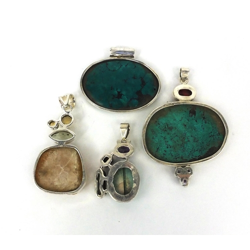 2658 - Four large silver pendants set with semi precious stones including turquoise and citrine, the larges... 