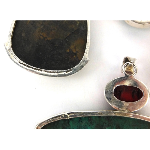 2595 - Four large silver pendants set with semi precious stones including turquoise and citrine, the larges... 