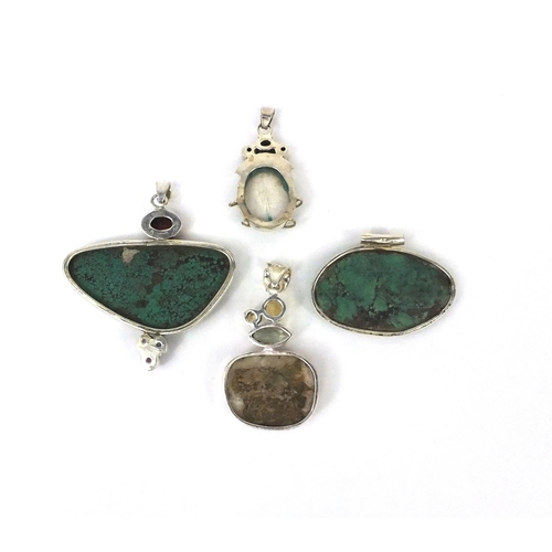 2613 - Four large silver pendants set with semi precious stones including turquoise and citrine, the larges... 