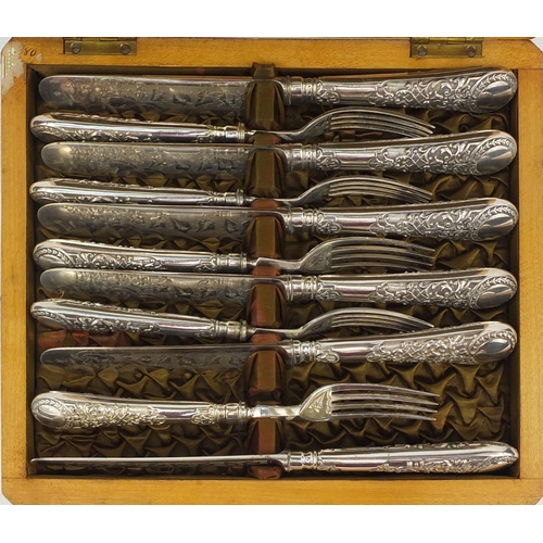 2245 - Cased set of six silver plated fish knives and forks, the handles with embossed decoration and the b... 