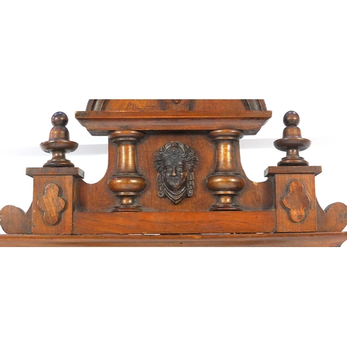 2084 - Carved walnut regulator clock with Roman numerals, decorated with an eagle, 93cm in length