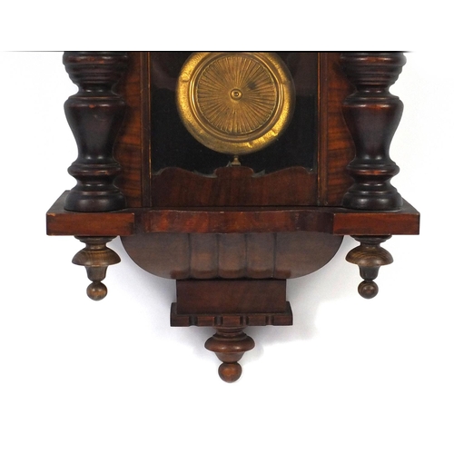 2084 - Carved walnut regulator clock with Roman numerals, decorated with an eagle, 93cm in length