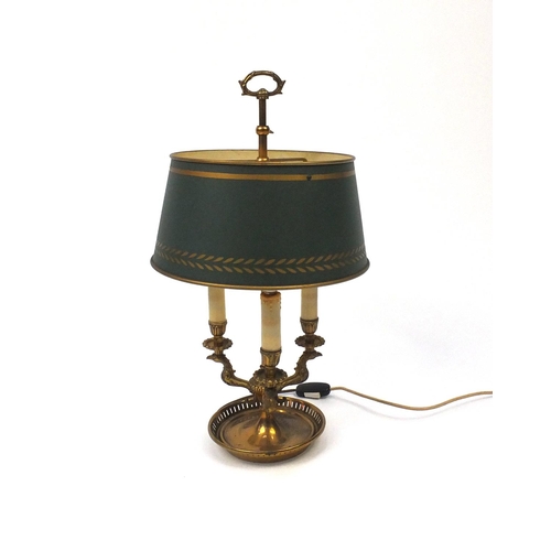 2079 - French style gilt three branch desk lamp with griffin branches and adjustable shade, 57cm high