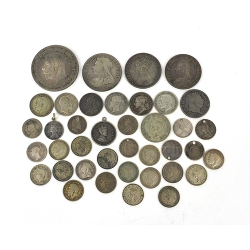 2775 - Group of British 19th century and later coinage, some silver, including 1881 Gothic florin, 1935 roc... 