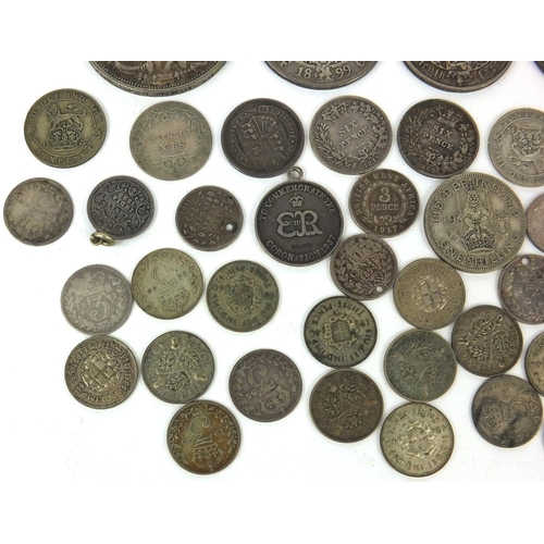 2775 - Group of British 19th century and later coinage, some silver, including 1881 Gothic florin, 1935 roc... 