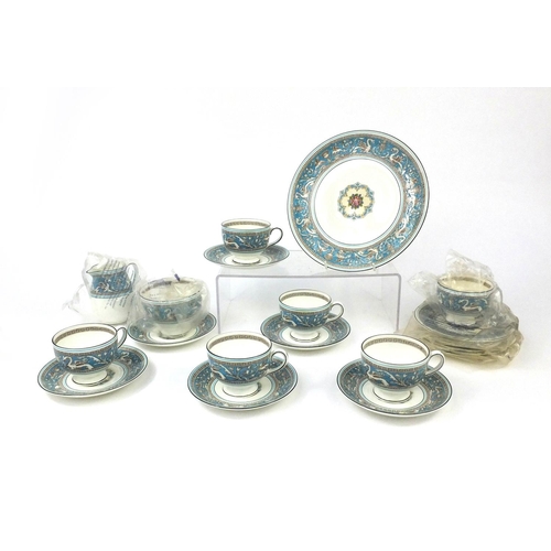 2240 - Wedgwood Florentine patterned six place tea service comprising six trios, milk jug, sugar bowl and a... 