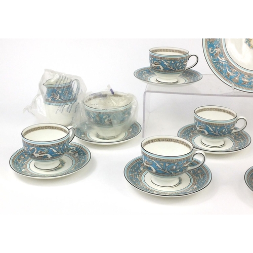 2240 - Wedgwood Florentine patterned six place tea service comprising six trios, milk jug, sugar bowl and a... 