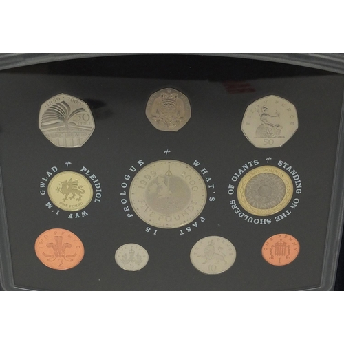 2764 - Group of uncirculated coin sets and four others including Royal Mint 2000 coin set, two £5 coins, Is... 