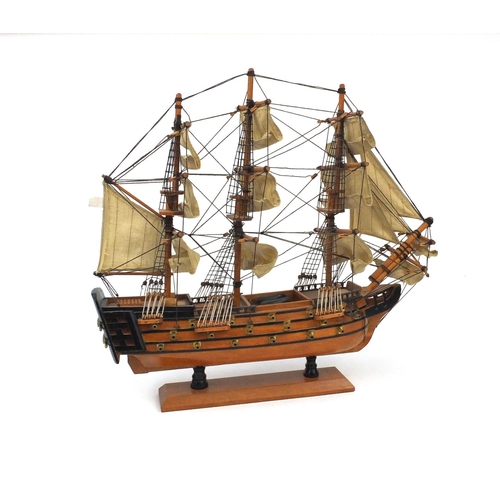 2219 - HMS Victory wooden model boat with canvas sails on stand, overall 45cm high