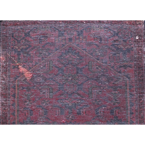 2093 - Rectangular Hamadan carpet runner with an all over geometric and floral design onto a red ground, 25... 