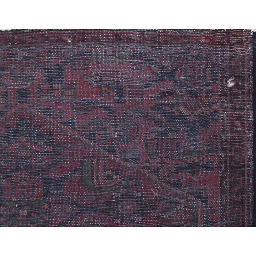 2093 - Rectangular Hamadan carpet runner with an all over geometric and floral design onto a red ground, 25... 