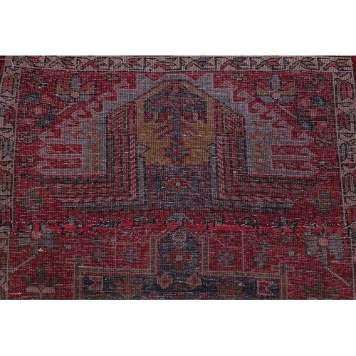 2076 - Rectangular Azarbaijan carpet runner with an all over stylised floral design onto a red ground, 320c... 