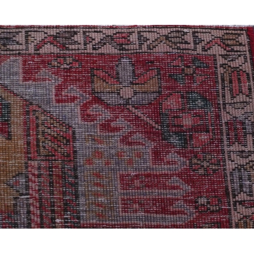 2076 - Rectangular Azarbaijan carpet runner with an all over stylised floral design onto a red ground, 320c... 