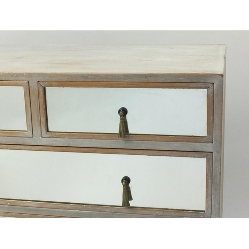 2005 - Bleached pine chest fitted with two short above three graduated long drawers with mirrored fronts an... 