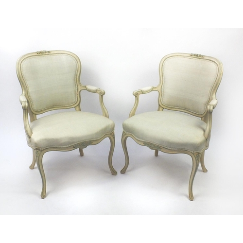 2038 - Pair of cream and green painted French fauteuil chairs with upholstered stuffover seats and back pan... 