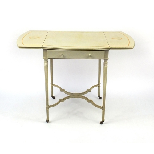 2040 - Cream and gilt painted Pembroke table on reeded legs with shaped stretcher, 72cm high