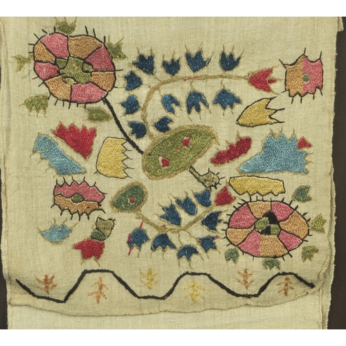 657 - Middle eastern embroidered cloth wall pocket, framed, 68cm x 27cm excluding the frame