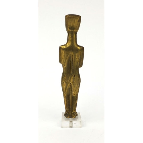 2260 - Brass modernist sculpture of a figure raised on a square Perspex base, 25cm high