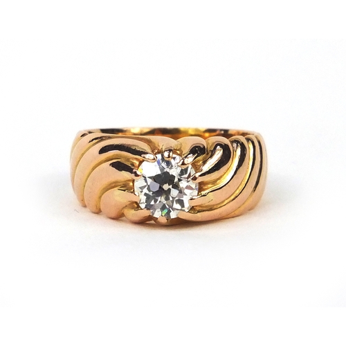 910 - Unmarked gold diamond solitaire ring with moulded decoration, size M, approximate weight 8.5g