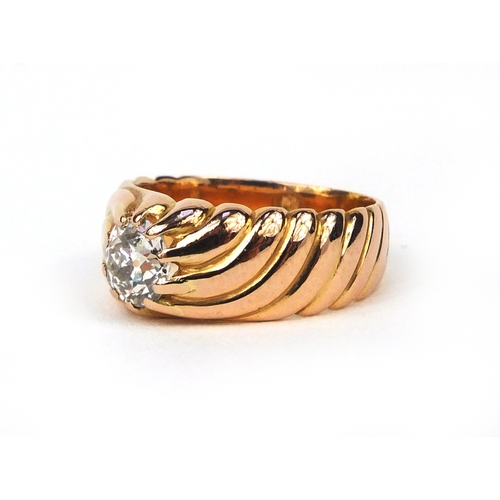 910 - Unmarked gold diamond solitaire ring with moulded decoration, size M, approximate weight 8.5g