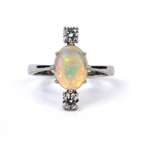 908 - 18ct white gold opal and diamond ring set with a central opal and two solitaire diamonds, size O, ap... 