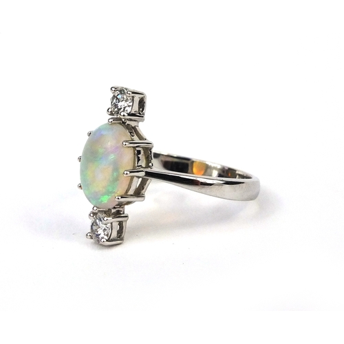 908 - 18ct white gold opal and diamond ring set with a central opal and two solitaire diamonds, size O, ap... 