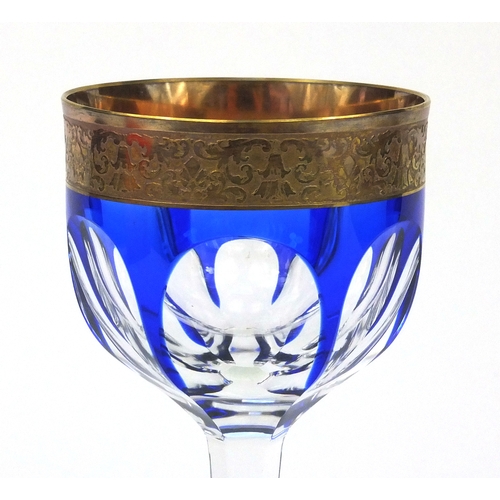 734 - Moser blue flashed Lady Hamilton wine glass, the rim with floral chase decoration, acid etched facto... 