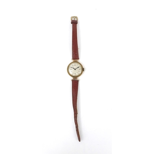 2623 - 9ct gold vintage ladies wristwatch with brown leather, 2.5cm in diameter