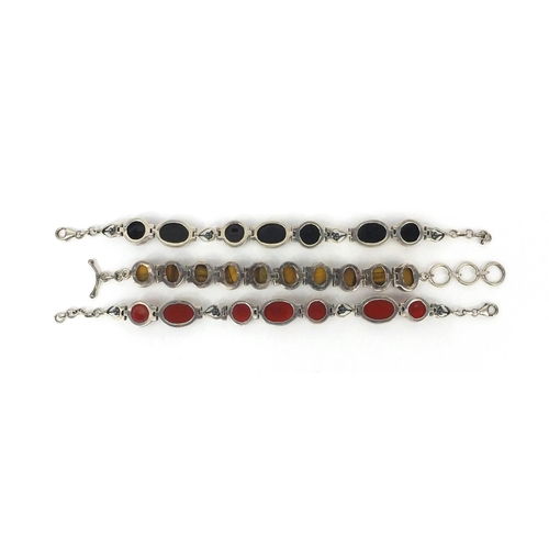 2649 - Three silver bracelets set with semi precious stones including tigers eye and cornelian, each 19cm l... 