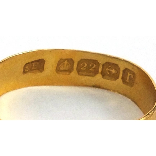 2504 - Two 22ct gold wedding bands, a 9ct gold wedding band and 15ct gold stud, approximate weight 7.0g