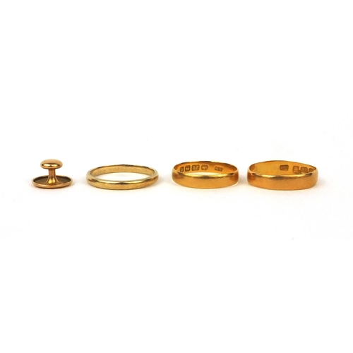 2504 - Two 22ct gold wedding bands, a 9ct gold wedding band and 15ct gold stud, approximate weight 7.0g