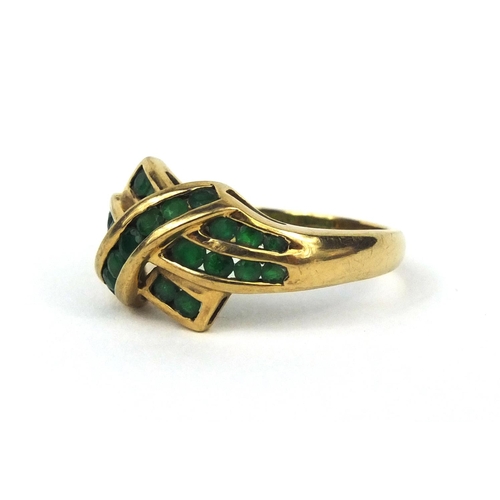 2599 - 9ct gold emerald crossover ring, size P, approximate weight 3.0g