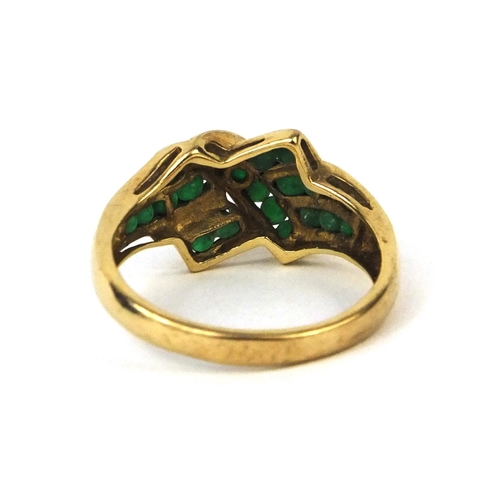 2599 - 9ct gold emerald crossover ring, size P, approximate weight 3.0g