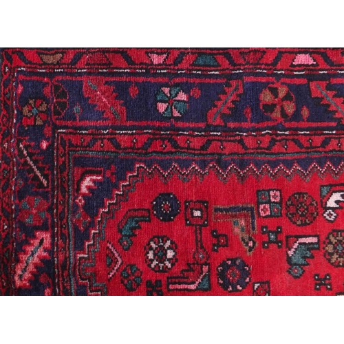 2089 - Rectangular Hamadan rug with an all over stylised geometric pattern within three borders onto a pred... 